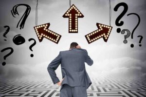 Trader drawing and analyzing a rising market chart, illustrating the illusion that a better trading strategy always exists and the tendency of traders to constantly search for new systems instead of trusting a proven process.