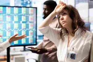 Trader reacting emotionally to market movements while refusing to accept changing price action, illustrating stubbornness in trading through emotional decision-making, holding losing positions, and ignoring objective market signals.