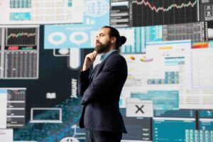 Trader switching between multiple trading strategies while reviewing market charts, illustrating how impatience, doubt, and unrealistic expectations often cause traders to abandon strategies before they have enough time to prove their effectiveness.