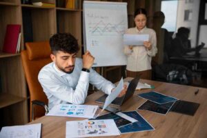 Trader analyzing multiple charts, indicators, and market data on several screens, illustrating that more analysis does not provide more control over unpredictable market movements or guarantee profitable trades.